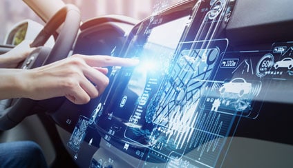 An image of a person clicking on car infotainment dashboard